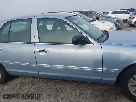 2003 Ford Crown Victoria LX z VIN 2FAFP74W83X180076, wystawiony jako IAAI lot #41744980 z przebiegiem 254 465 mil mil oraz . Historia ofert i sprzedaży dostępna na DreamBid. Obrazek 14.