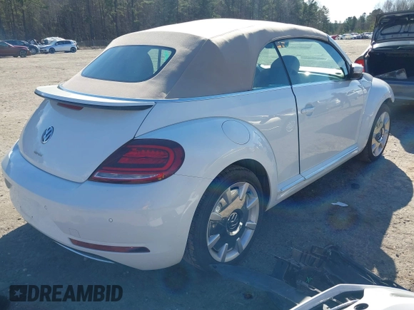 2018 Volkswagen Beetle S with VIN 3VW5DAAT1JM506988, listed as a IAAI auction lot 41589324 with 50,873 mi miles and . Bid and sale history available at DreamBid. Image 4.