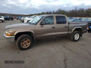 2001 Dodge Dakota z VIN 1B7GG2AX11S108005, wystawiony jako Copart lot #87124934 z przebiegiem 248 482 mil mil oraz Czysty tytuł • Clean title. Historia ofert i sprzedaży dostępna na DreamBid. Obrazek 1.