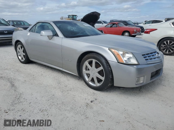 2004 Cadillac XLR z VIN 1G6YV34A945601007, wystawiony jako Copart lot #77077394 z przebiegiem Nie podano mil oraz Szkody całkowita. Historia ofert i sprzedaży dostępna na DreamBid. Obrazek 4.