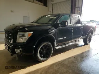 2017 Nissan Titan Pro-4X z VIN 1N6BA1F49HN545051, wystawiony jako Copart lot #53899355 z przebiegiem 143 418 mil mil oraz Tytuł czysty. Historia ofert i sprzedaży dostępna na DreamBid. Obrazek 1.