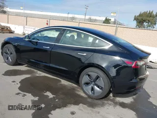 2019 Tesla Model 3 Mid Range with VIN 5YJ3E1EA2KF305834, listed as a IAAI auction lot 41719610 with 126,333 mi miles and . Bid and sale history available at DreamBid. Image 3.