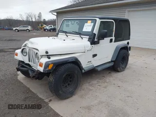 2005 Jeep Wrangler Sport with VIN 1J4FA49S25P352170, listed as a IAAI auction lot 41794958 with 154,304 mi miles. Bid and sale history available at carsss.com. Image 18.