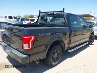 2015 Ford F-150 XLT with VIN 1FTEW1C89FKE65742, listed as a IAAI auction lot 42117957 with 153,413 mi miles and . Bid and sale history available at carsss.com. Image 4.