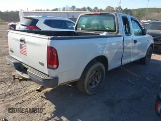 2003 Ford F-150 XL with VIN 1FTRX17W33NA66469, listed as a IAAI auction lot 41677909 with 236,619 mi miles. Bid and sale history available at carsss.com. Image 4.