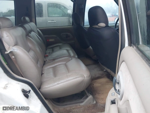 1999 Chevrolet Tahoe with VIN 1GNEC13RXXR101766, listed as a IAAI auction lot 41393447 with 387,448 mi miles. Bid and sale history available at carsss.com. Image 8.