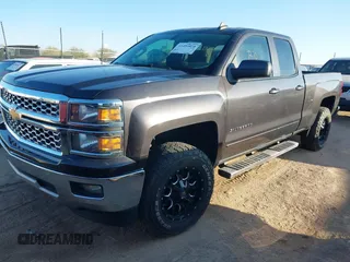 2015 Chevrolet Silverado 1500 LT with VIN 1GCRCREC1FZ308563, listed as a IAAI auction lot 41455858 with 162,196 mi miles. Bid and sale history available at carsss.com. Image 2.