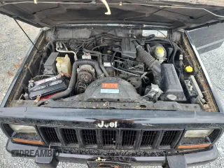 1999 Jeep Cherokee z VIN 1J4FF28P4XL560533, wystawiony jako Copart lot #59180605 z przebiegiem 190 262 mil mil oraz Czysty tytuł • Clean title. Historia ofert i sprzedaży dostępna na DreamBid. Obrazek 11.