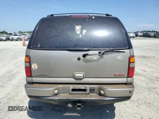 2003 GMC Yukon Denali z VIN 1GKEK63U13J255146, wystawiony jako Copart lot #53694665 z przebiegiem 256 523 mil mil oraz Szkody całkowita. Historia ofert i sprzedaży dostępna na DreamBid. Obrazek 6.