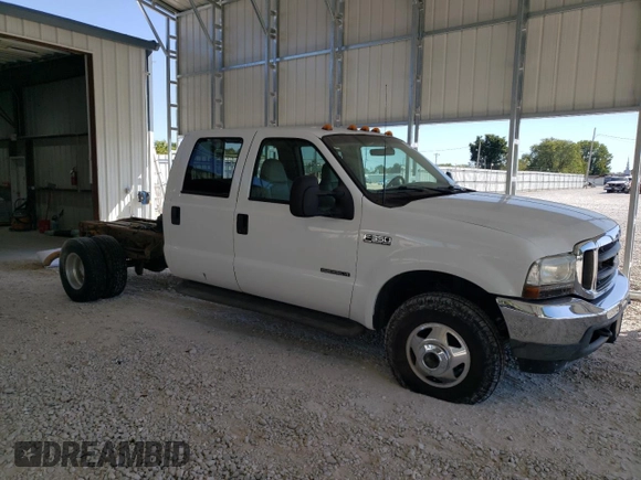 2002 Ford F-350 with VIN 1FDWW37F42EB55737, listed as a Copart auction lot 73678434 with 233,366 mi miles and Salvage title. Bid and sale history available at DreamBid. Image 4.