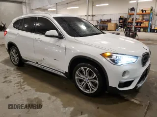2018 BMW X1 xDrive28i with VIN WBXHT3C30J5K29917, listed as a Copart auction lot 56165845 with 131,876 mi miles and Salvage title. Bid and sale history available at DreamBid. Image 4.