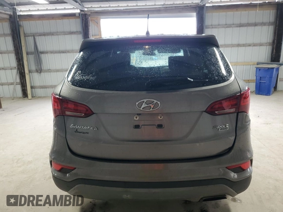 2018 Hyundai Santa Fe 2.4L z VIN 5NMZTDLB2JH096699, wystawiony jako Copart lot #53795775 z przebiegiem 165 794 mil mil oraz Szkoda całkowita • Salvage title. Historia ofert i sprzedaży dostępna na DreamBid. Obrazek 6.