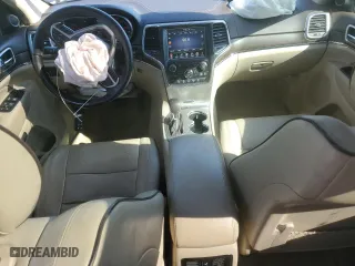 2017 Jeep Grand Cherokee Overland with VIN 1C4RJECG2HC712823, listed as a Copart auction lot 48063325 with 124,812 mi miles and Salvage Title. Bid and sale history available at carsss.com. Image 8.