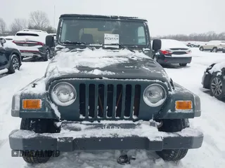 2004 Jeep Wrangler SE with VIN 1J4FA29154P778915, listed as a IAAI auction lot 41245325 with 205,852 mi miles and . Bid and sale history available at DreamBid. Image 12.