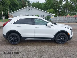 2022 Cadillac XT4 AWD Premium Luxury z VIN 1GYFZDR42NF128199, wystawiony jako IAAI lot #42522314 z przebiegiem 29 002 mil mil oraz . Historia ofert i sprzedaży dostępna na DreamBid. Obrazek 13.