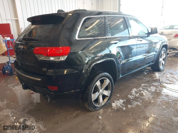 2014 Jeep Grand Cherokee Overland with VIN 1C4RJFCT7EC187319, listed as a IAAI auction lot 41256107 with 98,287 mi miles. Bid and sale history available at carsss.com. Image 4.
