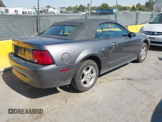 2003 Ford Mustang Deluxe z VIN 1FAFP44473F341011, wystawiony jako IAAI lot #42715064 z przebiegiem 177 458 mil mil oraz . Historia ofert i sprzedaży dostępna na DreamBid. Obrazek 4.