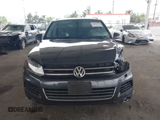 2014 Volkswagen Touareg Sport with VIN WVGEF9BP0ED015273, listed as a IAAI auction lot 42046823 with 84,694 mi miles and . Bid and sale history available at DreamBid. Image 12.