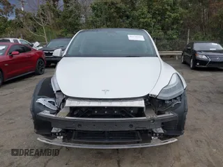 2023 Tesla Model Y Long Range z VIN 7SAYGDEE4PF621640, wystawiony jako IAAI lot #41796502 z przebiegiem 68 484 mil mil oraz . Historia ofert i sprzedaży dostępna na DreamBid. Obrazek 13.