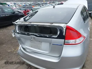 2010 Honda Insight EX with VIN JHMZE2H77AS022538, listed as a IAAI auction lot 41804579 with 184,000 mi miles and . Bid and sale history available at DreamBid. Image 6.