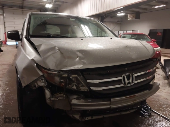 2012 Honda Odyssey LX with VIN 5FNRL5H27CB092988, listed as a IAAI auction lot 41933507 with 123,233 mi miles and . Bid and sale history available at DreamBid. Image 6.