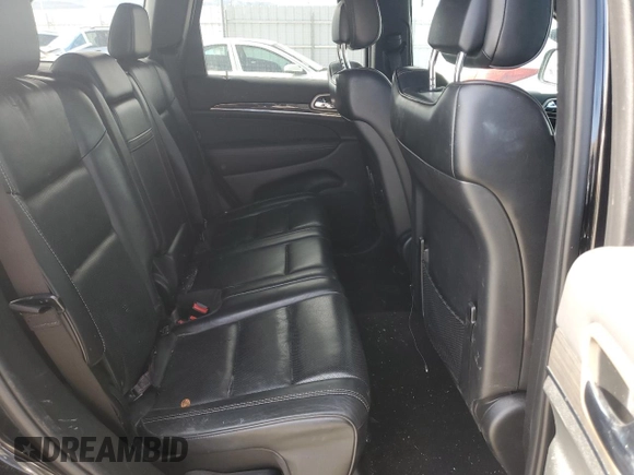 2014 Jeep Grand Cherokee Overland with VIN 1C4RJFCT2EC106002, listed as a Copart auction lot 48763675 with 143,011 mi miles and Salvage Title. Bid and sale history available at DreamBid. Image 11.