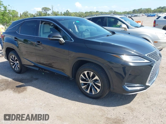 2021 Lexus RX with VIN 2T2AZMAA2MC196524, listed as a IAAI auction lot 42017362 with 80,922 mi miles. Bid and sale history available at carsss.com. Image 1.