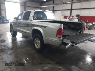 2004 Dodge Dakota SLT with VIN 1D7HG48N64S523528, listed as a IAAI auction lot 41199575 with 261,239 mi miles. Bid and sale history available at carsss.com. Image 3.