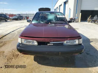 1989 Toyota Camry DLX z VIN 4T1SV21E3KU053153, wystawiony jako Copart lot #49917485 z przebiegiem 79 028 mil mil oraz Szkoda całkowita • Salvage title. Historia ofert i sprzedaży dostępna na DreamBid. Obrazek 5.
