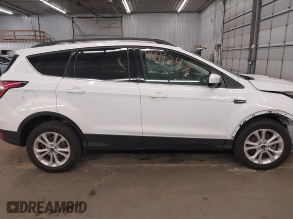 2018 Ford Escape SE z VIN 1FMCU9GD2JUB17518, wystawiony jako IAAI lot #41919245 z przebiegiem 102 626 mil mil oraz . Historia ofert i sprzedaży dostępna na DreamBid. Obrazek 14.