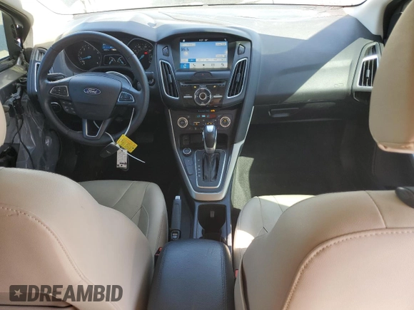 2017 Ford Focus Titanium with VIN 1FADP3J22HL279854, listed as a Copart auction lot 61209135 with 106,323 mi miles and Salvage title. Bid and sale history available at DreamBid. Image 8.
