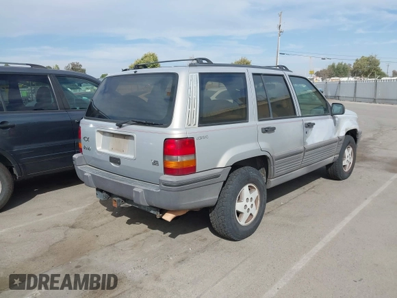 1994 Jeep Grand Cherokee Laredo with VIN 1J4GZ58YXRC325868, listed as a IAAI auction lot 42664900 with 220,149 mi miles and . Bid and sale history available at DreamBid. Image 4.