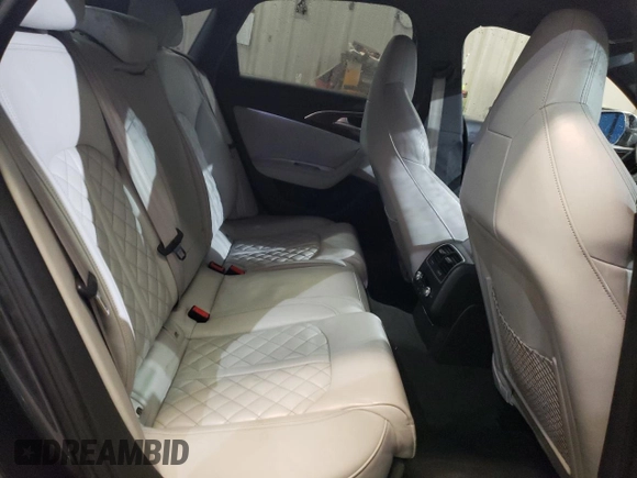 2016 Audi S6 Premium Plus z VIN WAUF2AFC4GN100284, wystawiony jako Copart lot #86496964 z przebiegiem 100 537 mil mil oraz Szkody całkowita. Historia ofert i sprzedaży dostępna na DreamBid. Obrazek 11.