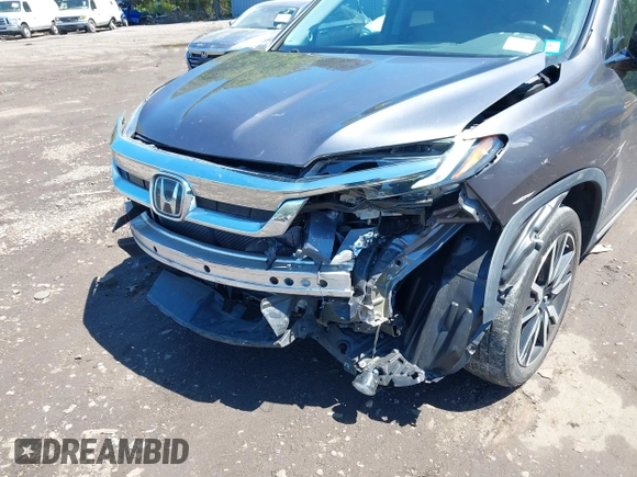 2021 Honda Pilot Touring 8-Passenger z VIN 5FNYF6H9XMB059037, wystawiony jako IAAI lot #42202410 z przebiegiem 49 267 mil mil oraz . Historia ofert i sprzedaży dostępna na DreamBid. Obrazek 6.