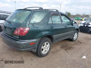 1999 Lexus RX 300 Luxury SUV with VIN JT6HF10U0X0034001, listed as a IAAI auction lot 41804468 with 166,072 mi miles. Bid and sale history available at carsss.com. Image 4.