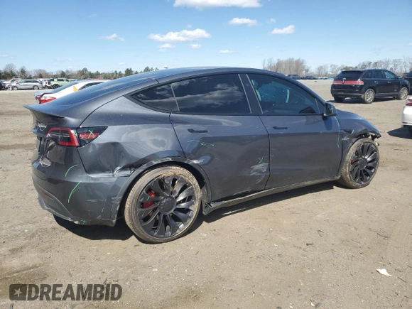 2023 Tesla Model Y Performance with VIN 7SAYGDEF3PF946496, listed as a Copart auction lot 50800315 with 15,077 mi miles and Salvage Title. Bid and sale history available at DreamBid. Image 3.