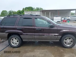 2004 Jeep Grand Cherokee Laredo z VIN 1J4GW48S94C209326, wystawiony jako IAAI lot #42309565 z przebiegiem 159 429 mil mil oraz . Historia ofert i sprzedaży dostępna na DreamBid. Obrazek 13.