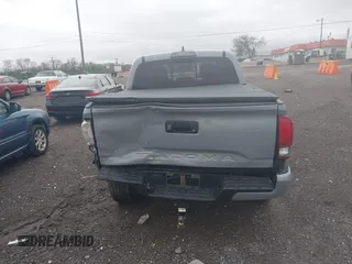2019 Toyota Tacoma SR z VIN 3TMCZ5AN1KM206969, wystawiony jako IAAI lot #41951159 z przebiegiem 94 875 mil mil oraz . Historia ofert i sprzedaży dostępna na DreamBid. Obrazek 16.