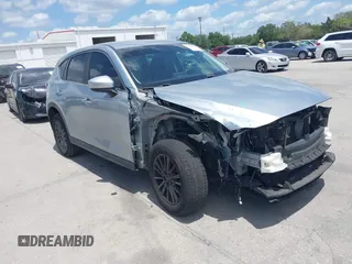 2017 Mazda CX-5 Sport with VIN JM3KFABLXH0135560, listed as a IAAI auction lot 42062016 with 153,416 mi miles. Bid and sale history available at carsss.com. Image 1.