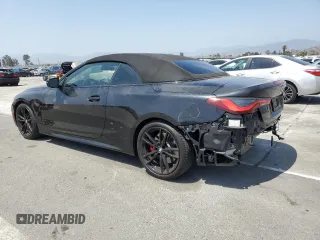 2022 BMW 4 Series M440i with VIN WBA53AT01NCJ52404, listed as a Copart auction lot 54464474 with 16,880 mi miles and Salvage title. Bid and sale history available at DreamBid. Image 2.