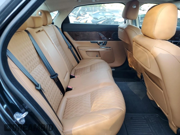 2016 Jaguar XJ Portfolio с VIN SAJWJ2GD5G8W02952, выставлен на аукционе Copart как лот 75216074 с пробегом 98 766 миль миль и Чистый • Clean title. История ставок и продаж доступна на DreamBid. Изображение 10.
