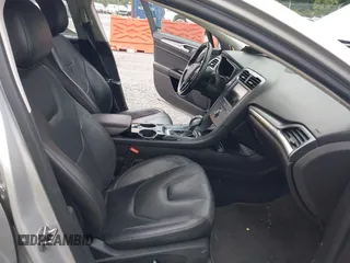 2013 Ford Fusion Titanium Hybrid with VIN 3FA6P0RU3DR281914, listed as a IAAI auction lot 42380838 with 166,956 mi miles and . Bid and sale history available at DreamBid. Image 5.