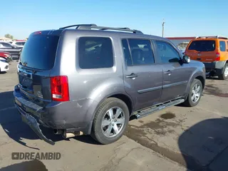 2014 Honda Pilot Touring z VIN 5FNYF4H90EB033259, wystawiony jako IAAI lot #42287774 z przebiegiem 115 416 mil mil oraz . Historia ofert i sprzedaży dostępna na DreamBid. Obrazek 4.