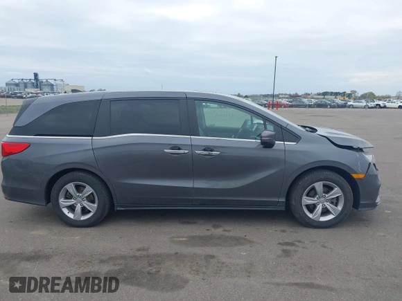 2018 Honda Odyssey EX-L z VIN 5FNRL6H72JB090127, wystawiony jako IAAI lot #42167788 z przebiegiem 114 984 mil mil oraz . Historia ofert i sprzedaży dostępna na DreamBid. Obrazek 13.