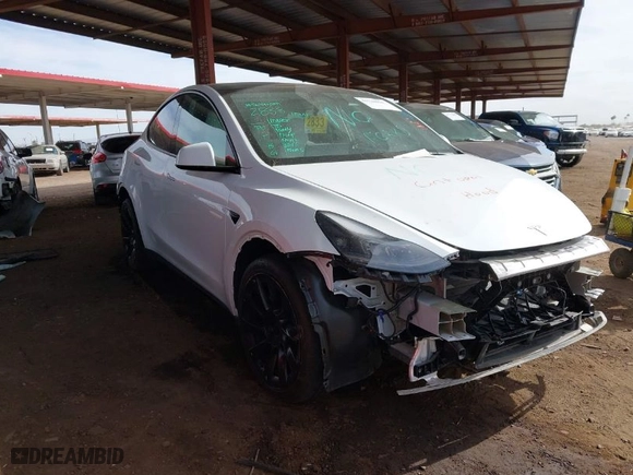 2023 Tesla Model Y Long Range with VIN 7SAYGDEEXPF691580, listed as a IAAI auction lot 41728604 with 19,601 mi miles. Bid and sale history available at carsss.com. Image 1.