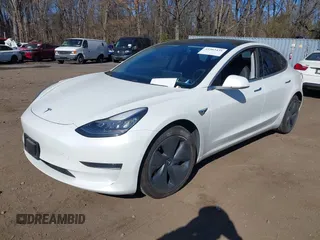 2020 Tesla Model 3 Standard Range Plus with VIN 5YJ3E1EA0LF783672, listed as a IAAI auction lot 41903431 with 52,157 mi miles and . Bid and sale history available at carsss.com. Image 2.