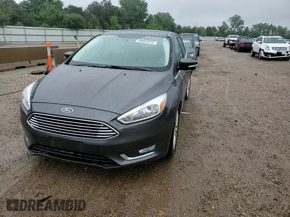2018 Ford Focus Titanium z VIN 1FADP3N21JL295883, wystawiony jako Copart lot #59051015 z przebiegiem 43 284 mil mil oraz Szkoda całkowita • Salvage title. Historia ofert i sprzedaży dostępna na DreamBid. Obrazek 13.