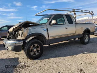 1999 Ford F-150 XL with VIN 1FTRX18L2XKA01348, listed as a Copart auction lot 50087595 with 202,021 mi miles and Salvage Title. Bid and sale history available at carsss.com. Image 1.