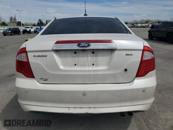 2012 Ford Fusion SEL z VIN 3FAHP0JAXCR282521, wystawiony jako Copart lot #53115505 z przebiegiem 96 833 mil mil oraz Szkoda całkowita • Salvage title. Historia ofert i sprzedaży dostępna na DreamBid. Obrazek 6.