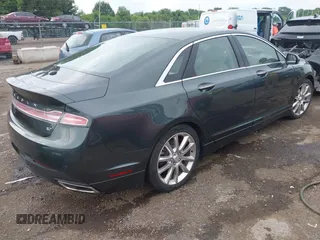 2016 Lincoln MKZ z VIN 3LN6L2GK4GR605486, wystawiony jako IAAI lot #42609084 z przebiegiem Nie podano mil oraz . Historia ofert i sprzedaży dostępna na DreamBid. Obrazek 4.